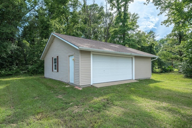 garage with a yard