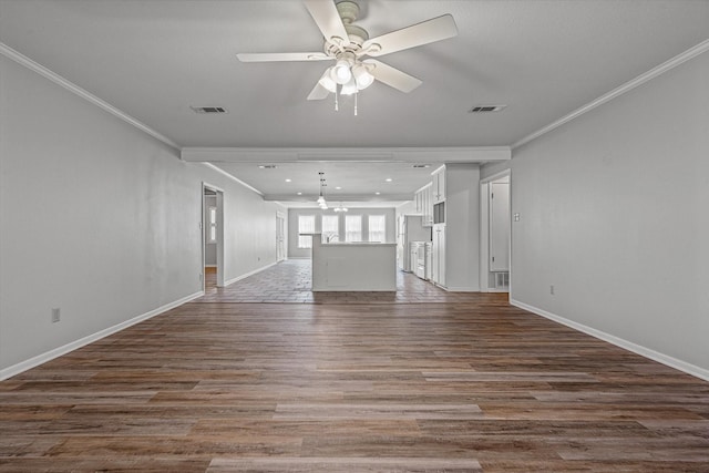 unfurnished living room with ceiling fan, dark hardwood / wood-style flooring, and crown molding