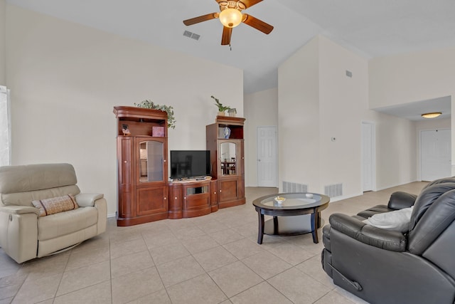 living room featuring ceiling fan, light tile patterned flooring, and high vaulted ceiling