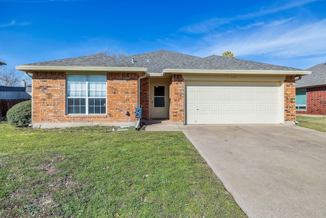 ranch-style home with a front yard and a garage