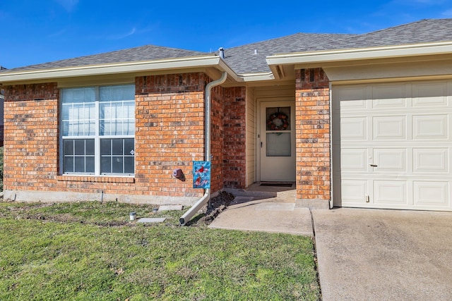 view of front of property with a front yard and a garage