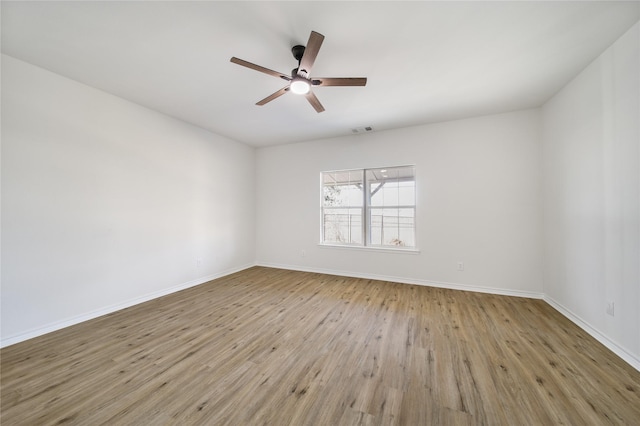 spare room with ceiling fan and light hardwood / wood-style flooring