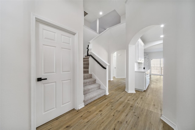 entrance foyer with light hardwood / wood-style flooring