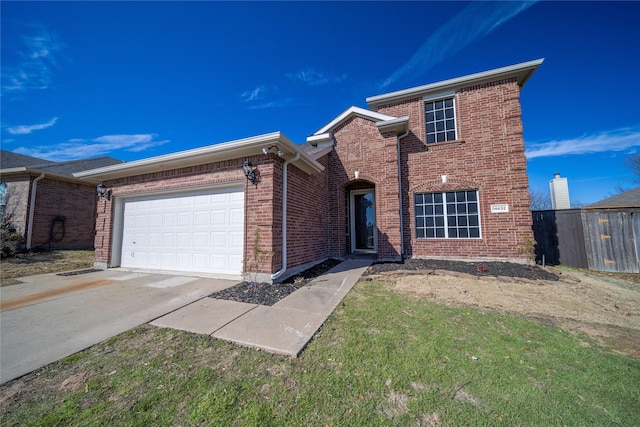 view of front of property featuring a front lawn and a garage