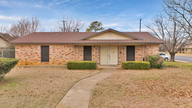 single story home featuring a front lawn and a porch