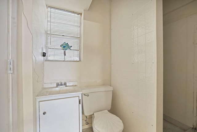 bathroom with toilet and vanity