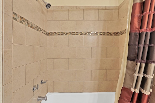 bathroom with shower / bath combo