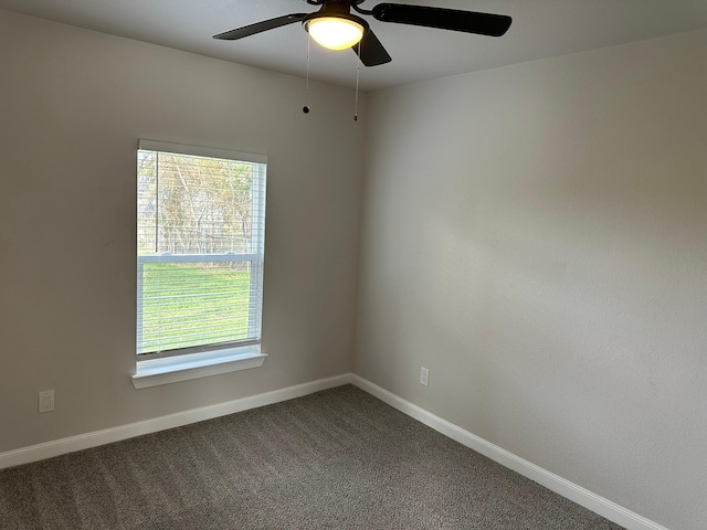 empty room featuring carpet and ceiling fan