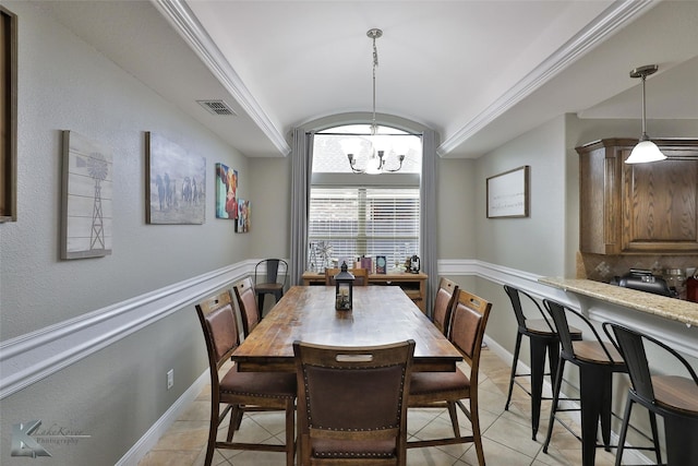 dining area featuring light tile patterned flooring and a chandelier