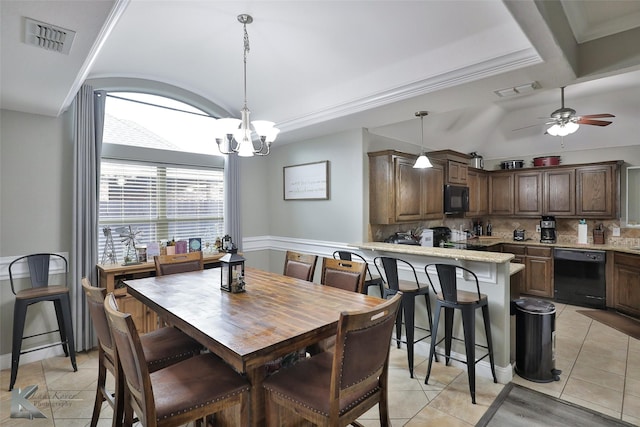 tiled dining room featuring ceiling fan with notable chandelier