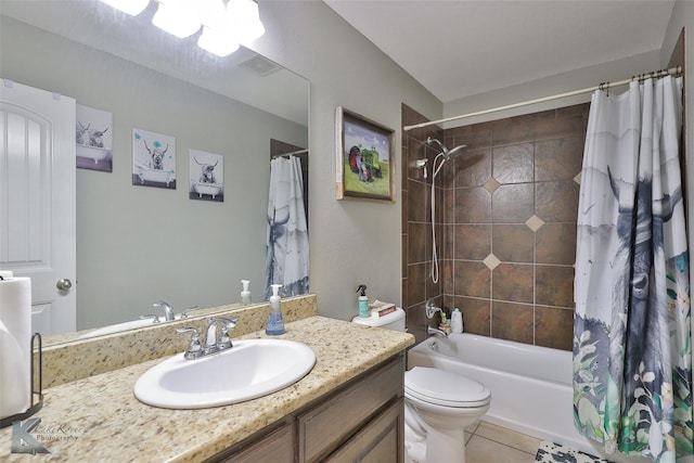 full bathroom featuring toilet, tile patterned floors, vanity, and shower / bath combo with shower curtain