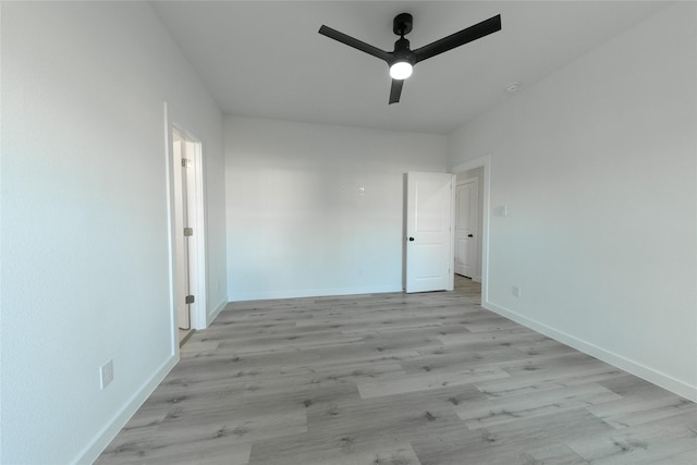 spare room with ceiling fan and light hardwood / wood-style floors