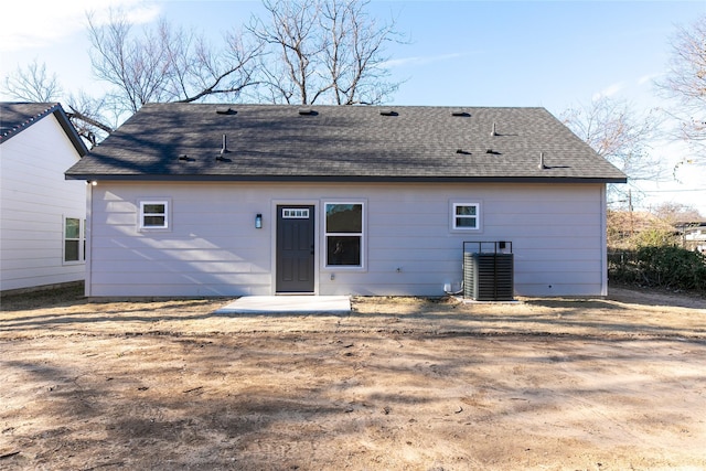 rear view of house with cooling unit