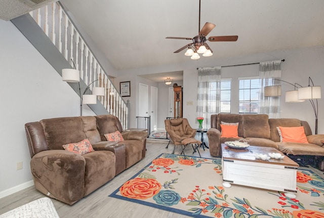 living room featuring ceiling fan and wood-type flooring