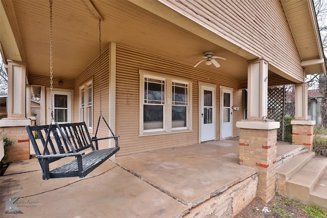 view of patio featuring ceiling fan and a porch