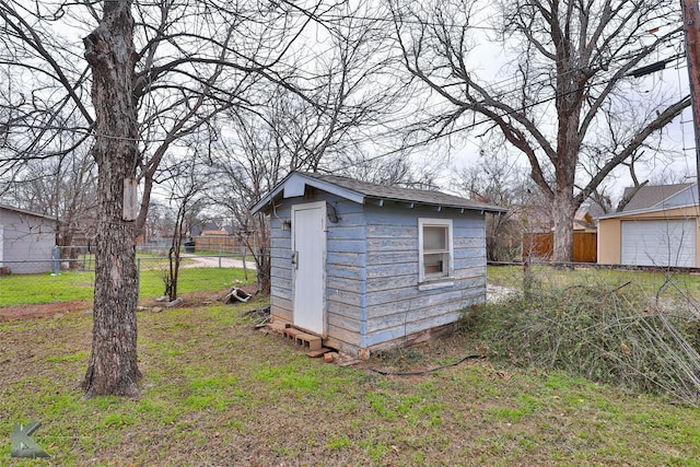 view of outbuilding with a lawn