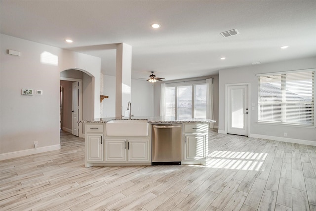 300 Ben Thomas St, Burleson, TX 76028 - kitchen with dishwasher, a ceiling fan, light stone counters, white cabinets, and light wood-type flooring
