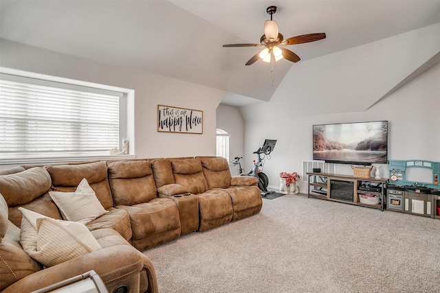 living area with carpet floors, ceiling fan, and lofted ceiling