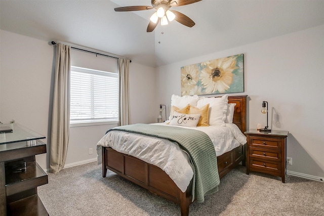 bedroom with lofted ceiling, carpet flooring, a ceiling fan, and baseboards