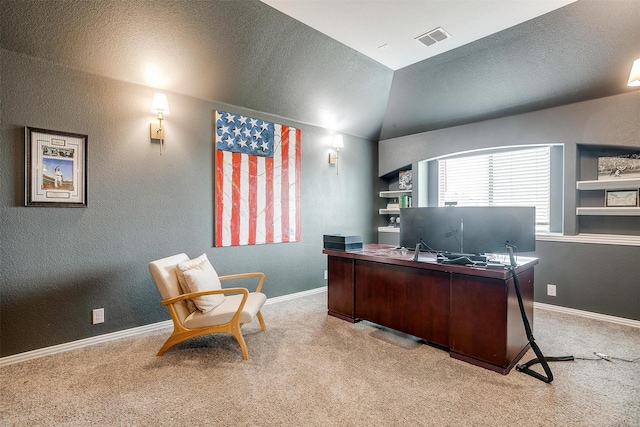 carpeted office space featuring a textured ceiling, a textured wall, visible vents, baseboards, and vaulted ceiling