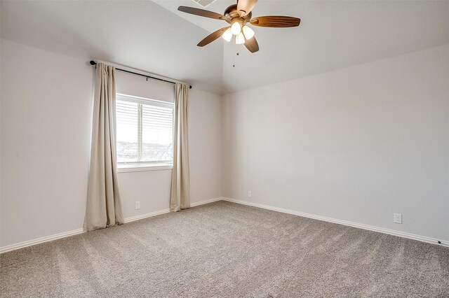 carpeted living room featuring vaulted ceiling, ceiling fan, and plenty of natural light