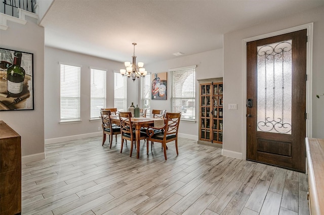 300 Ben Thomas St, Burleson, TX 76028 - dining space with a chandelier and light wood-type flooring