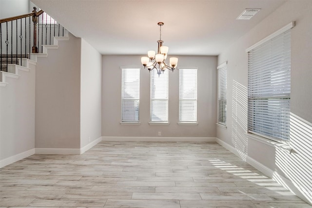 300 Ben Thomas St, Burleson, TX 76028 - unfurnished dining area featuring a chandelier, light wood finished floors, and stairs