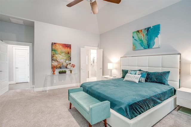 bedroom with ceiling fan, carpet, connected bathroom, and lofted ceiling