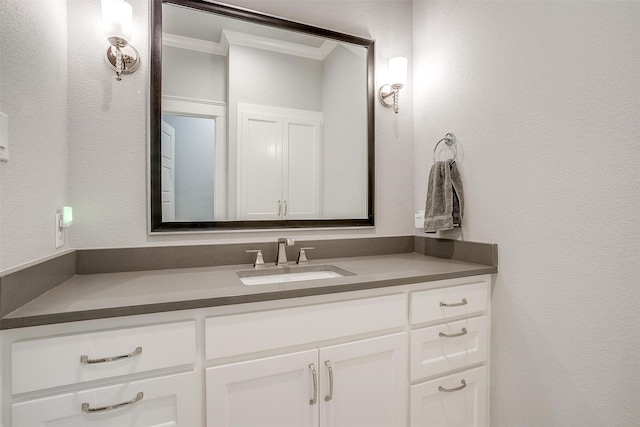 bathroom featuring vanity and crown molding