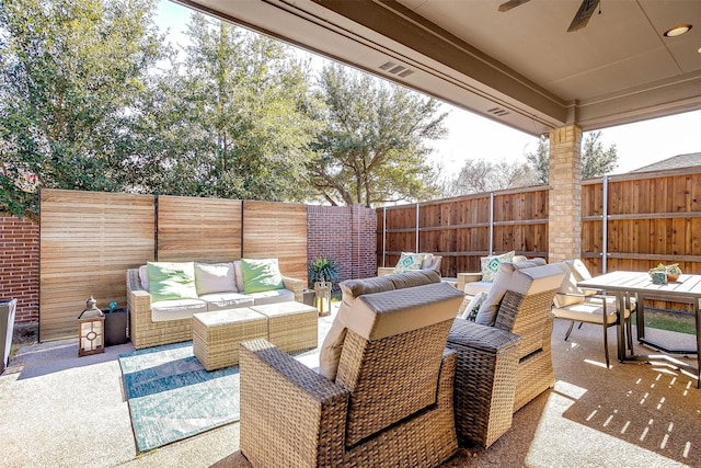 view of patio with ceiling fan and an outdoor living space