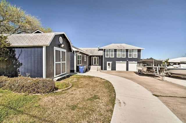 exterior space featuring a garage and a front yard