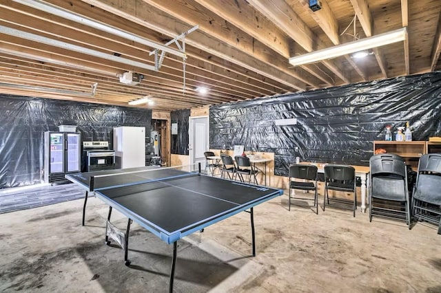 recreation room featuring concrete flooring