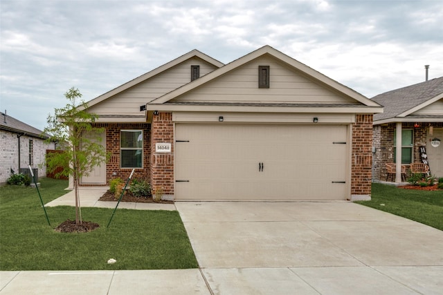 view of front of home featuring a garage, a front yard, and central AC