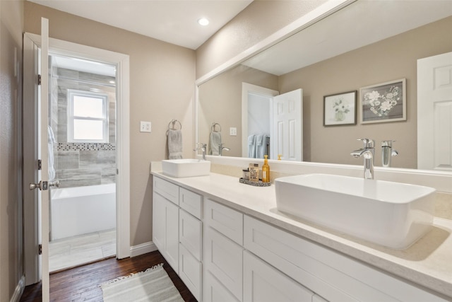 bathroom featuring vanity and hardwood / wood-style floors