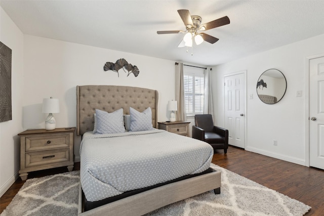 bedroom with ceiling fan and dark hardwood / wood-style flooring