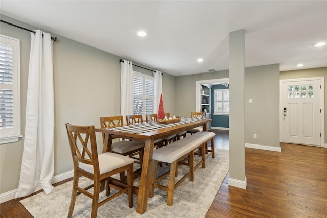 dining room with dark hardwood / wood-style flooring