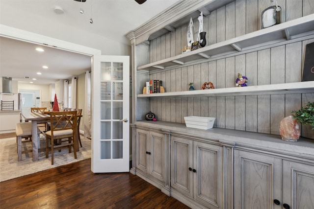 bar featuring dark wood-type flooring