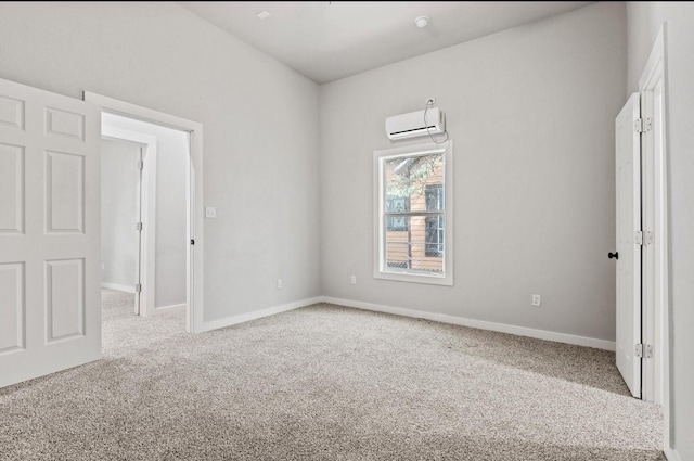 carpeted empty room with a wall mounted air conditioner