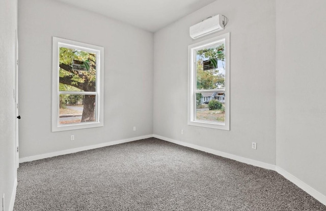 carpeted spare room with a wall mounted AC