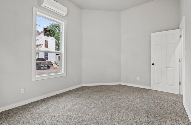 empty room with carpet and an AC wall unit