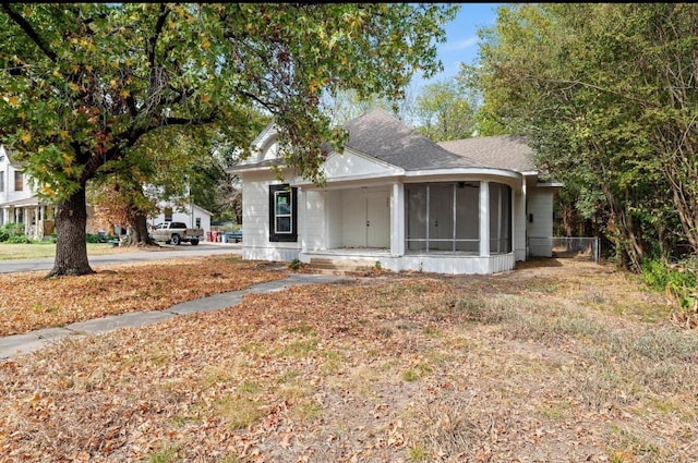 view of front facade with a sunroom