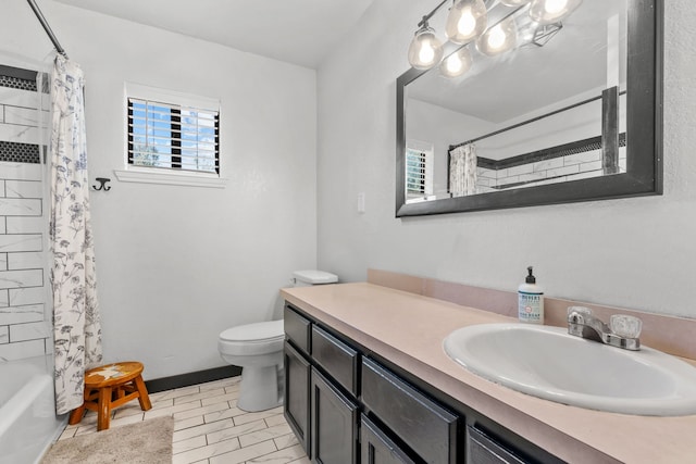 full bathroom with tile patterned floors, toilet, vanity, and shower / tub combo