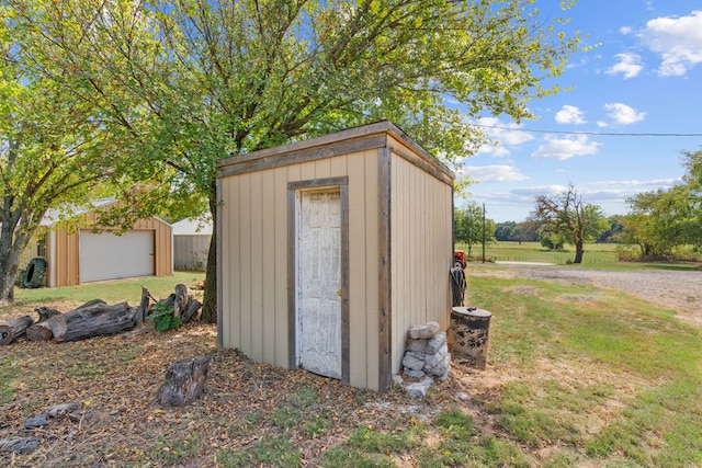 view of outbuilding with a yard