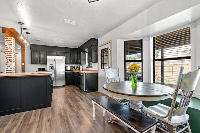 dining room featuring light hardwood / wood-style flooring and sink