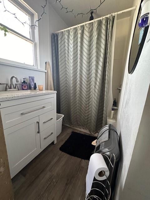 bathroom with vanity and hardwood / wood-style floors