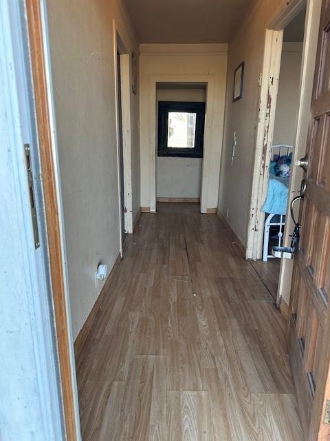 corridor featuring wood-type flooring