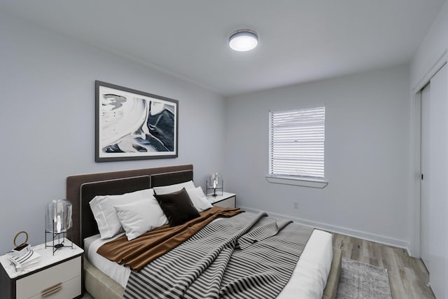 bedroom with light wood-type flooring