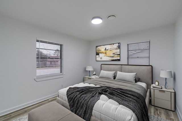 bedroom with light hardwood / wood-style flooring