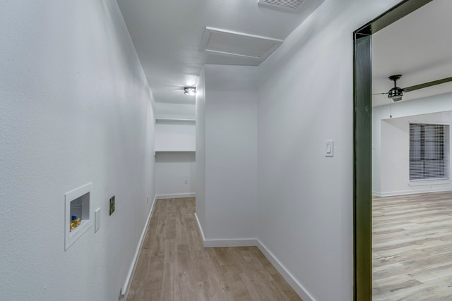 corridor with light hardwood / wood-style floors