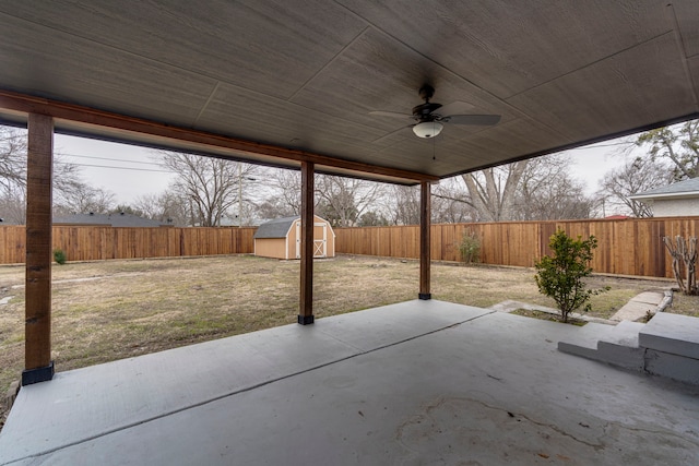 view of patio / terrace featuring ceiling fan and a shed